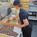 A woman assembling chocolate cookies at The Silky Oak Chocolate Company
